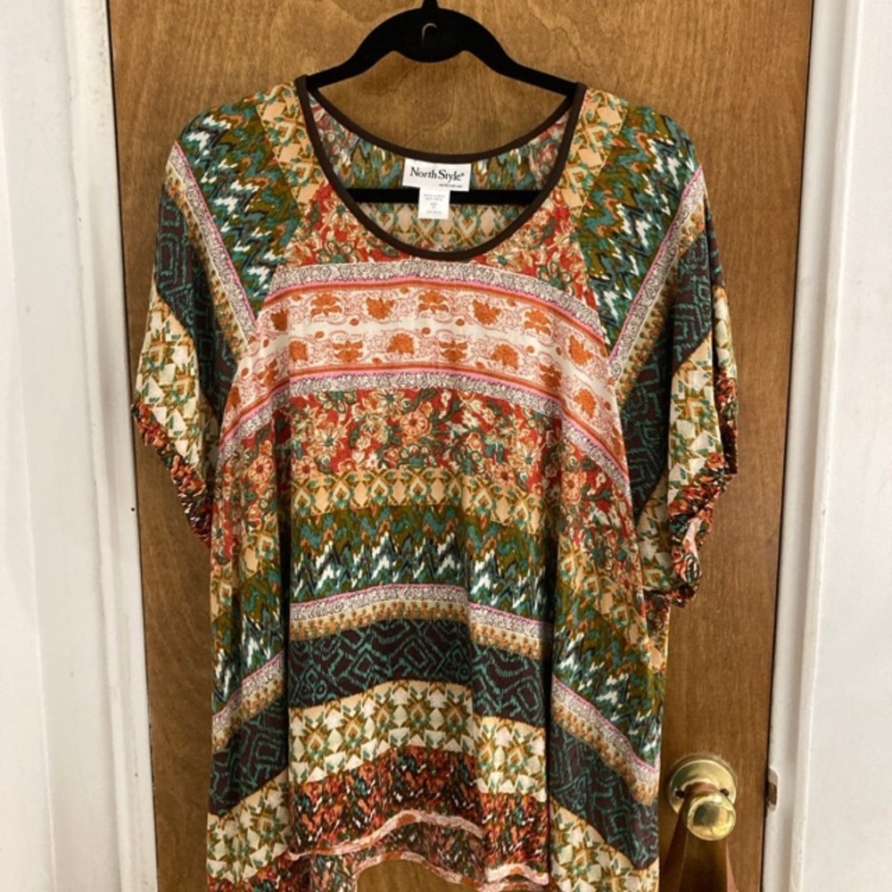 Mixed print tunic blouse with handkerchief hem at side seam
